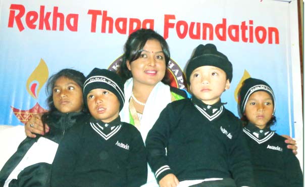 Thapa with her adopted-children.