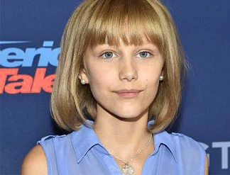 grace vanderwaal standing on stage