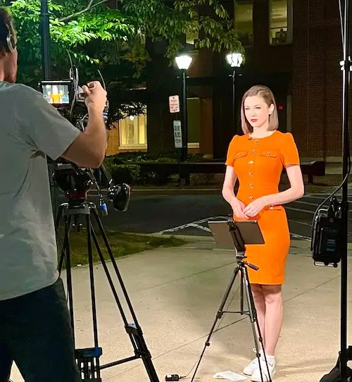 chanley painter standing in front of camera 